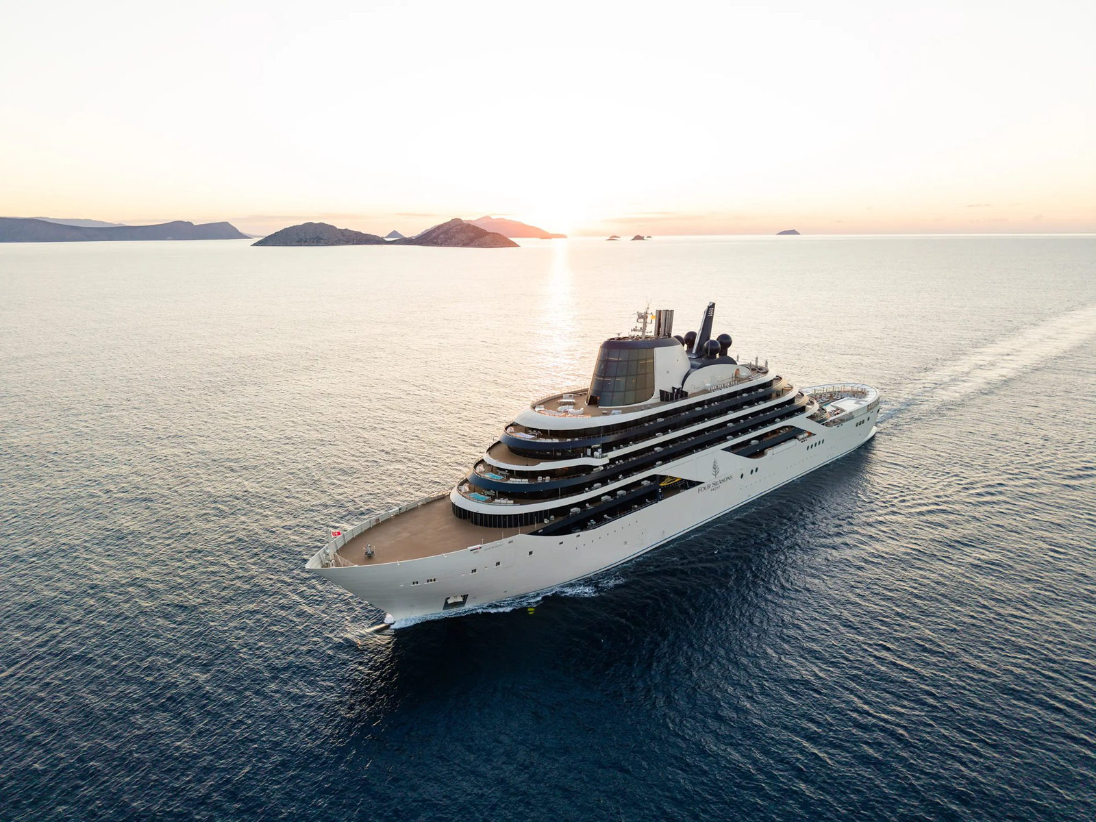 Four Seasons I sailing at sunset